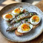Receta de sardinas y huevos servidas en un plato